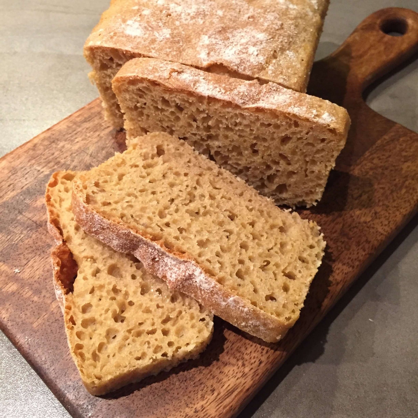 Connies spelt corn bread baked bread on wooden plate baking mixture purezento for me website www.purezentoforme.com