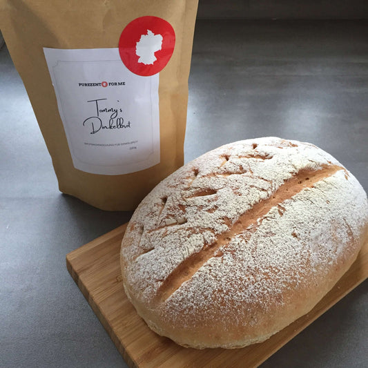 tommys spelt bread Product packaging with bread baking mixture baked bread on wooden plate purezento for me website www.purezentoforme.com